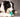Border collie chewing a turquoise rubber dental chew ball