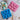 Pink and blue silicone dog treat moulds with finished paw and bone treats on a plate