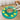 Beagle beside a green interactive dog puzzle slow feeder filled with kibble