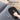 Washable reusable grooming glove removing dog hair from sofa